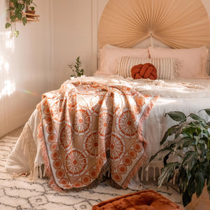 THE NAZAR WOVEN BLANKET IN PEACH BY CAI & JO